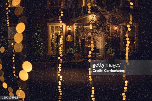 christmas lights outside a house, ireland - snowfall and lights night defocussed stock pictures, royalty-free photos & images