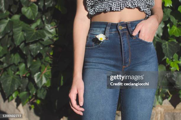 close-up of a teenage girl with her hand in her jeans pocket, argentina - girl close up stock-fotos und bilder