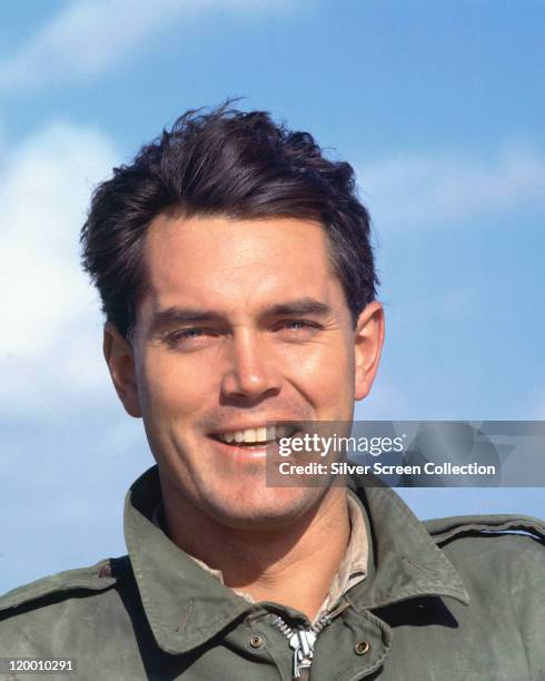 Headshot of Jeffrey Hunter , US actor, against a background of blue sky and clouds, circa 1965.