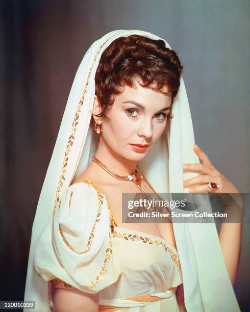 Jean Simmons . Britiish actress, wearing a white dress with gold trim, and a matching veil, in a publicity portrait issued for the film, 'Desiree',...