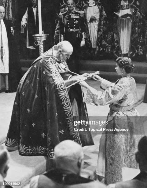 The coronation of Queen Elizabeth II in Westminster Abbey, London, 2nd June 1953. The Archbishop of Canterbury, Geoffrey Fisher, presents the Queen...