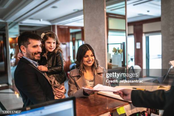 family arriving at the hotel - entering atmosphere stock pictures, royalty-free photos & images