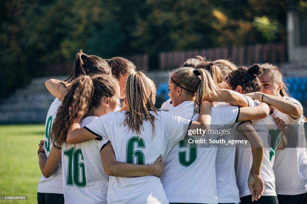 Women soccer team celebrating victory