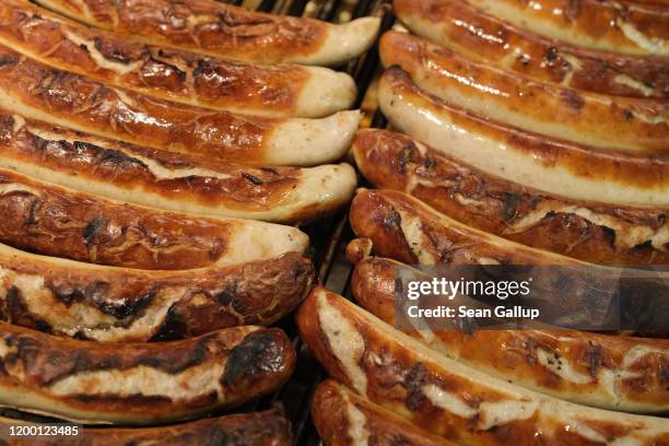 Bratwurst lies grilling and for sale at the Green Week agricultural trade fair on January 17, 2020 in Berlin, Germany. Green Week will be open to the...