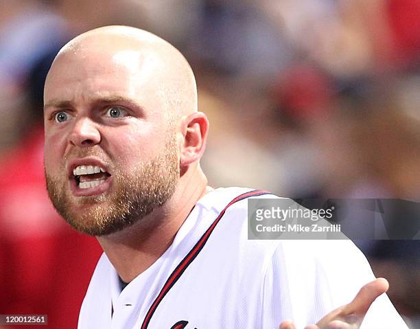 Catcher Brian McCann of the Atlanta Braves argues with home plate umpire Dan Iassogna during the game against the Pittsburgh Pirates at Turner Field...