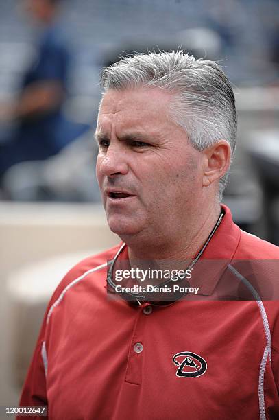 General manager Kevin Towers of the Arizona Diamondbacks looks on from the dugout before a baseball game against the San Diego Padres at Petco Park...