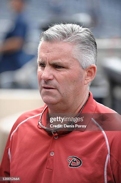 General manager Kevin Towers of the Arizona Diamondbacks looks on from the dugout before a baseball game between the Arizona Diamondbacks and the San...