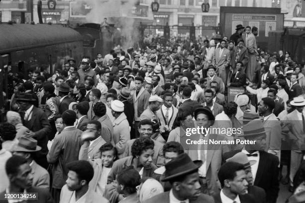 Some of the 981 West Indian immigrants newly arrived at Waterloo Station, London, on the boat train from Southampton, 15th October 1961.
