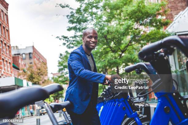 young adult commuter going at work in the city streets - week stock pictures, royalty-free photos & images