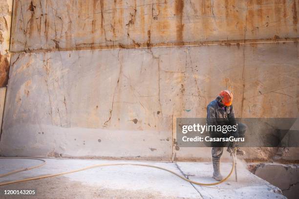 quarryman using jackhammer - stock photo - jackhammer stock pictures, royalty-free photos & images
