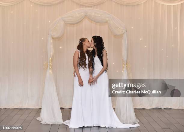 Robyn Peoples and Sharni Edwards embrace and kiss after they became Northern Ireland's first legally married same sex couple on February 11, 2020 in...