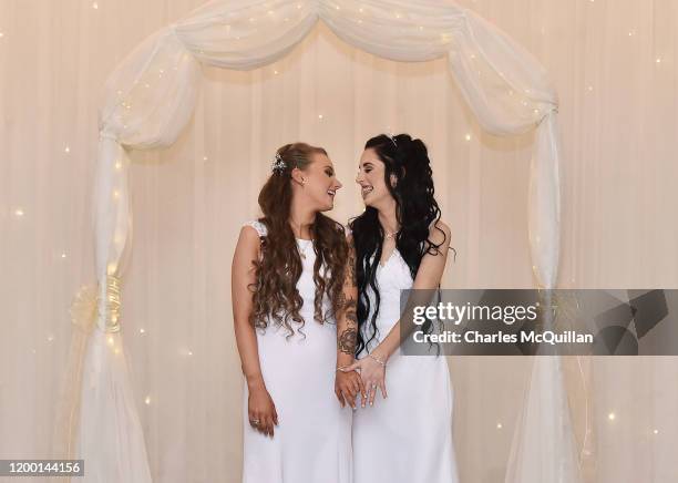 Robyn Peoples and Sharni Edwards embrace and kiss after they became Northern Ireland's first legally married same sex couple on February 11, 2020 in...