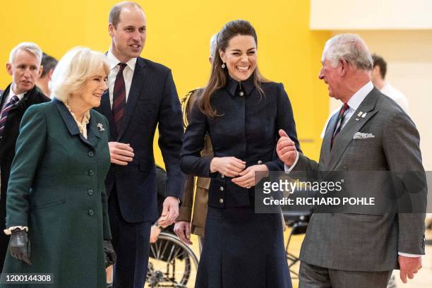 Britain's Prince William, Duke of Cambridge and his wife Britain's Catherine, Duchess of Cambridge talk with his father Britain's Prince Charles,...