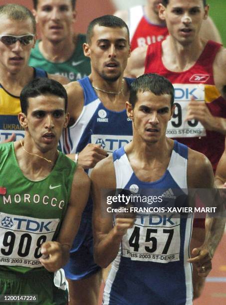 Photo prise le 27 août 2003 à Saint-Denis du Marocain Hicham El Guerrouj et du Français Mehdi Baala poursuivis par le Français Fouad Chouki , lors de...