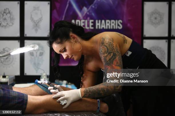 Tattoo artist Adele Harris works on a client during the 3rd Annual Christchurch International Tattoo Expo on January 17 2020 in Christchurch, New...