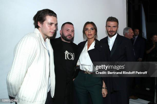 Brooklyn Beckham, Stylist Kim Jones, Victoria Beckham and David Beckham pose after the Dior Homme Menswear Fall/Winter 2020-2021 show as part of...