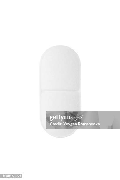white pill on white background - comprimés photos et images de collection