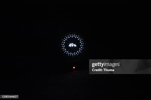 watch charging at night - thuma stock pictures, royalty-free photos & images