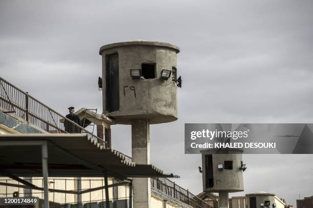 Picture taken during a guided tour organised by Egypt's State Information Service on February 11 shows an Egyptian policeman near watch towers at...
