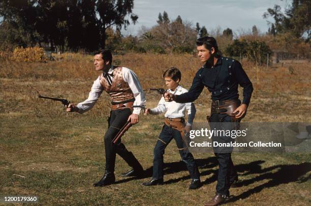 Actor Hugh O'Brian as Wyatt Earp with Brad Morrow carrying guns in the TV series "The Life and Legend of Wyatt Earp" in Los Angeles, California.