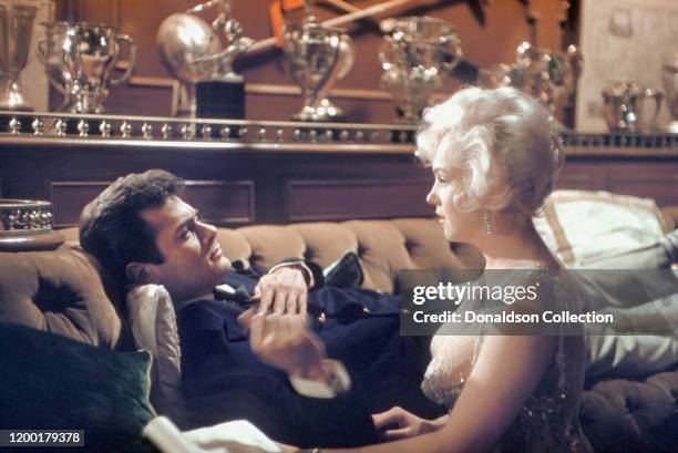 Actress Marilyn Monroe and Tony Curtis during a scene from the movie "Some Like it Hot" in Los Angeles, California.