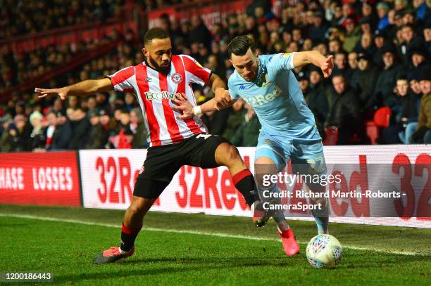 Leeds United's Jack Harrison vies for possession with Brentford's Bryan Mbeumo during the Sky Bet Championship match between Brentford and Leeds...