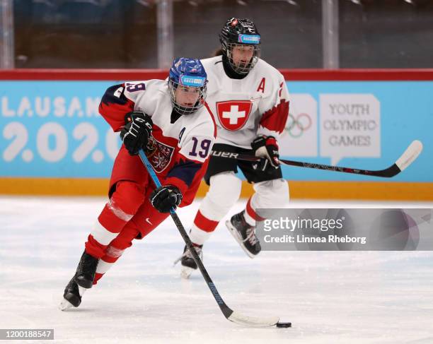 Barbora Mazancova of Czech Republic and Jana Peter of Switzerland in action during the Women's Ice Hockey 6-Team Tournament Preliminary Round - Group...