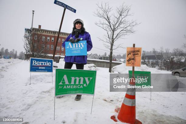 Former legislator Evelyn Merrick stands outside of the Lancaster Town Hall in Lancaster, NH in an effort to sway voters to cast their ballet for Amy...