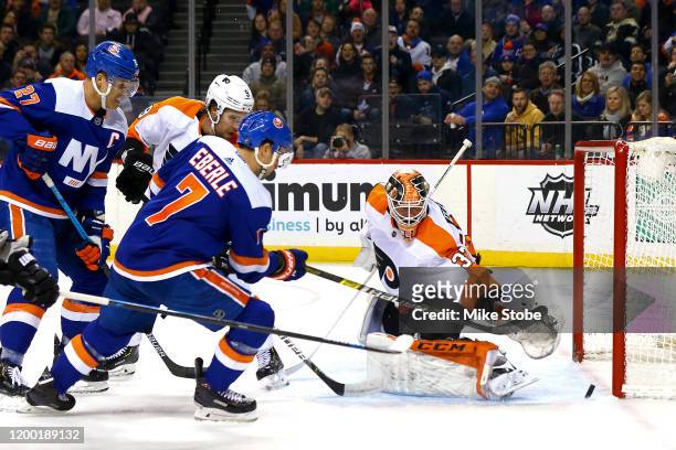 Jordan Eberle of the New York Islanders scores a goal past Brian Elliott of the Philadelphia Flyers during the first period at Barclays Center on...