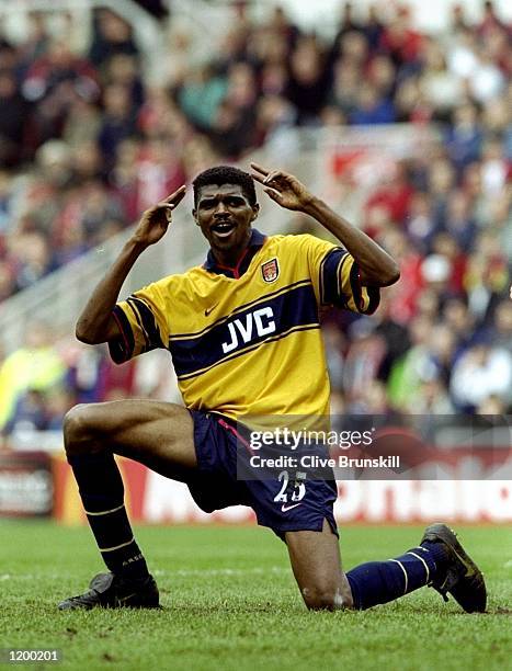 Nwankwo Kanu of Arsenal celebrates the first of his two goals against Middlesbrough in the FA Carling Premiership match at the Riverside Stadium in...