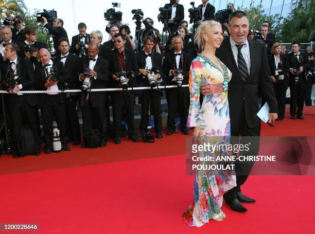 French stand-up comedian Jean-Marie Bigard poses 19 May 2007 with his wife Claudia upon arriving at the Festival Palace in Cannes, southern France,...