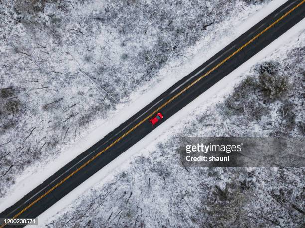 winter driving landscape - red car stock pictures, royalty-free photos & images