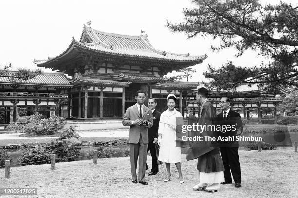 King Bhumibol and Queen Sirikit of Thailand visit the Phoenix Hall of the Byodoin Temple on May 31, 1963 in Uji, Kyoto, Japan.