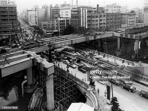 Shuto Expressway construction over the Nihonbashi bridge continues on June 13, 1963 in Tokyo, Japan.
