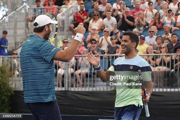 Fabrice Martin of France and Maximo Gonzalez of Argentina celebrate winning the men's doubles grand final against Ivan Dodig of Croatia and Filip...