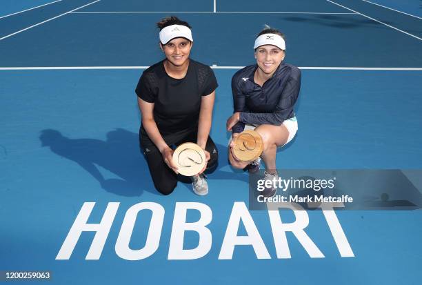 Nadiia Kichenok of Ukraine and Sania Mirza of India pose after winning their final doubles match against Zhang Shuai and Shuai Peng of China during...