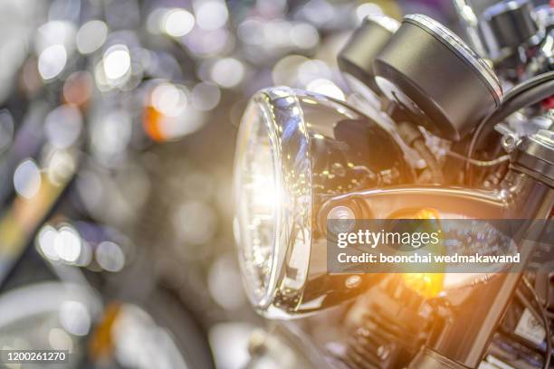 a closeup of a headlight on a motorcycle - bike handle stock pictures, royalty-free photos & images