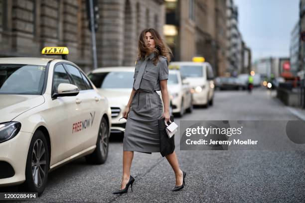 Füsun Lindner wearing Bottega Veneta bag, Celine shades, Max Mara skirt and top, Balenciaga heels and Charles and Keith mini bag during the Berlin...