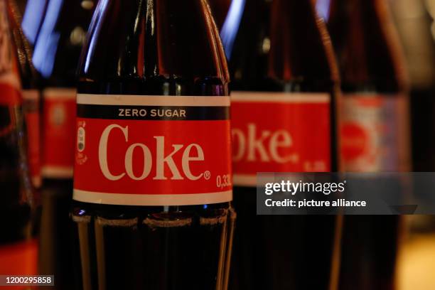 February 2020, Berlin: Bottles of the brand "Coca Cola" are lined up in the cinema Zoo Palast. Photo: Gerald Matzka/dpa-Zentralbild/ZB