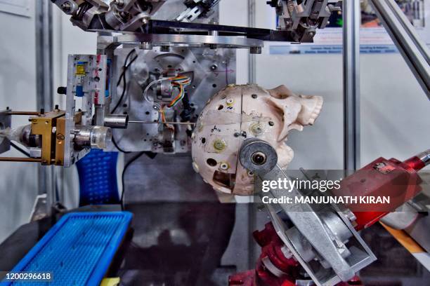 Prototype of a robot developed by Bhabha Atomic Research Centre used in neurosurgery procedures is seen on display during the National Science Day...