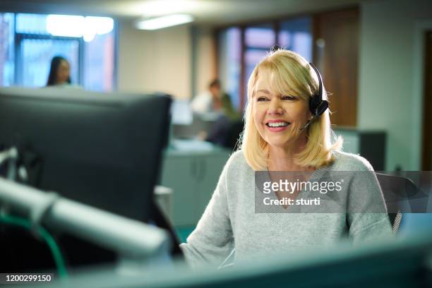 call centre worker - assistance stock pictures, royalty-free photos & images