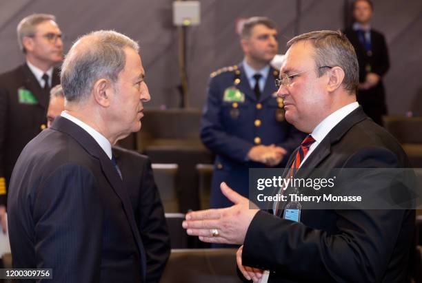 Turkish Defense Minister Hulusi Akar is talking with the Romanian Minister of National Defense Nicolae-Ionel Ciuca during the first meeting of NATO...