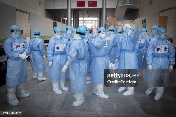 Nurses in fangcang hospital, Wuhan City, Hubei Province, China, February 12, 2020.- PHOTOGRAPH BY Costfoto / Future Publishing