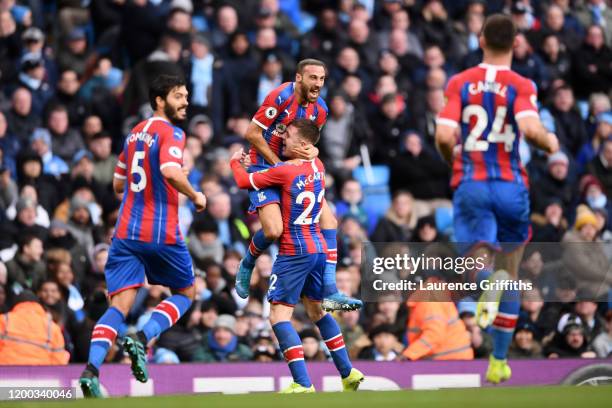 Cenk Tosun of Crystal Palace celebrates with teammates James McCarthy, James Tomkins and Gary Cahill of Crystal Palace after scoring his sides first...