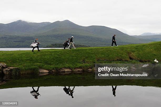 Darren Clarke of Northern Ireland and Gregory Bourdy of France walk up to the 4th tee during the Second Round of the Discover Ireland Irish Open held...