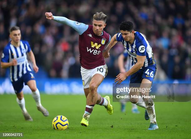 Jack Grealish of Aston Villa breaks past Steven Alzate of Brighton & Hove Albion during the Premier League match between Brighton & Hove Albion and...