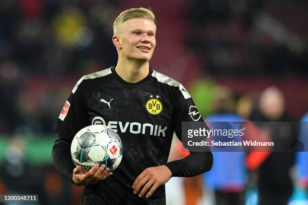 Erling Haaland of Borussia Dortmund holds the match ball after the Bundesliga match between FC Augsburg and Borussia Dortmund at WWK-Arena on January...