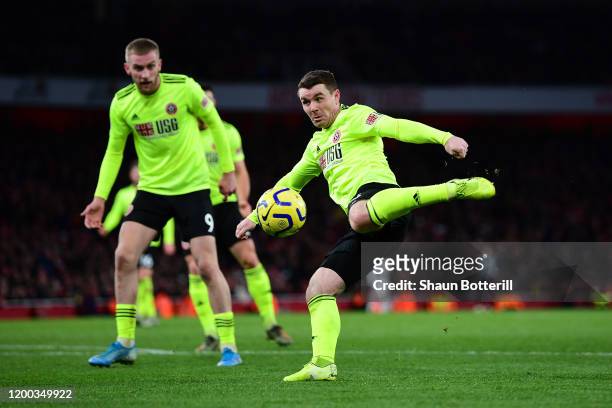 John Fleck of Sheffield United shoots and scores his sides first goal during the Premier League match between Arsenal FC and Sheffield United at...