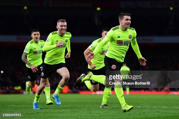 John Fleck of Sheffield United celebrates scoring his sides first goal during the Premier League match between Arsenal FC and Sheffield United at...
