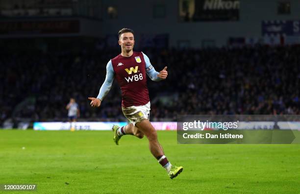 Jack Grealish of Aston Villa celebrates after scoring his team's first goal during the Premier League match between Brighton & Hove Albion and Aston...